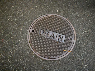 Round drain cover at a cleanout access